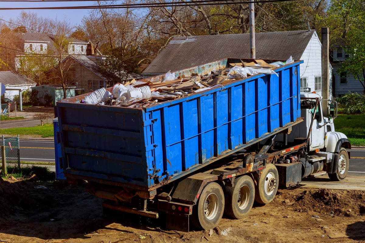 Full trash dumpsters ready to be hauled away during a cleanout